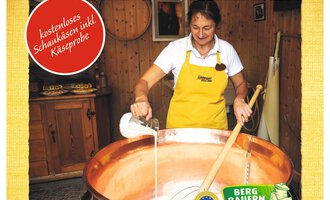 A poster for a cheese exhibition featuring Alpine cheese-making. It shows a woman in traditional attire making cheese in a large cauldron. | © Schönegger Käsealm