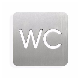 A simple indication of a toilet, depicted on a stainless steel sign. The letters "WC" are highlighted in white.