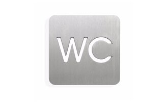 A modern restroom sign made of stainless steel. The letters "WC" are clearly visible and neatly designed.